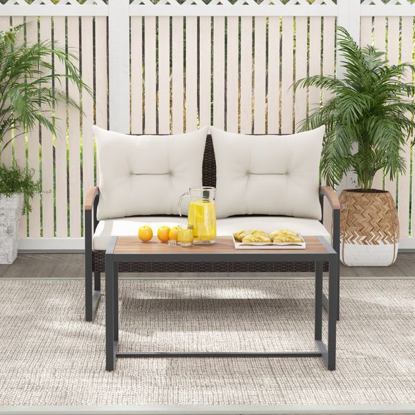 2-piece patio furniture set featuring PE wicker and an acacia wood coffee table