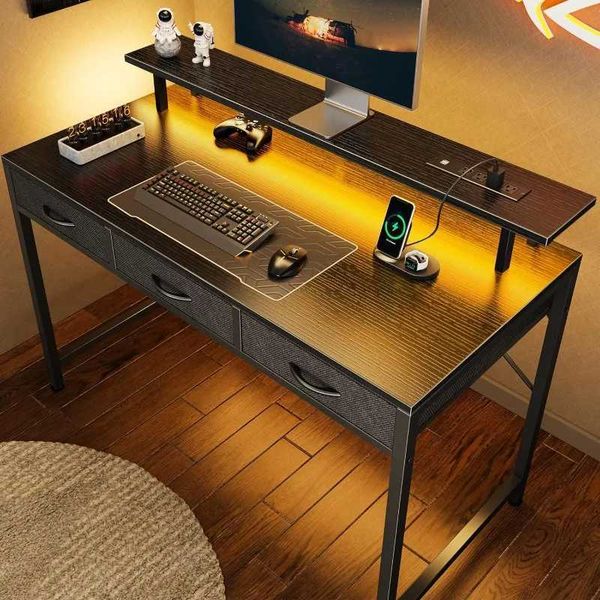 47-inch multifunctional computer desk with 3 drawers, LED lighting, and built-in power outlets for home or office use