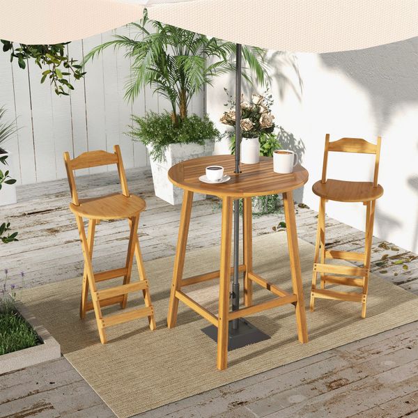 Bar height table featuring an umbrella hole and slatted top for outdoor use