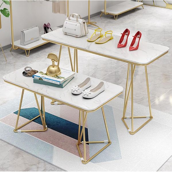 Clothing store display featuring commercial furniture with high and low water tables combined with jewelry solid wood racks