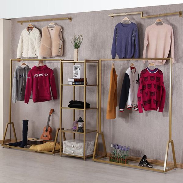 Clothing store display racks  
Bedroom furniture with gold flooring  
Women's clothing shop decorative shelves