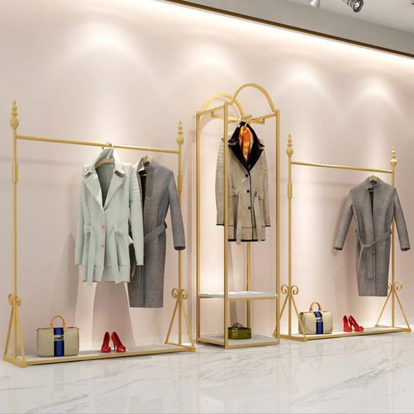 Commercial furniture for clothing stores: simple gold iron floor racks to display men's and women's apparel