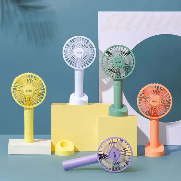 Compact USB-powered mini fan with phone holder for dorm rooms, travel, and outdoor use
