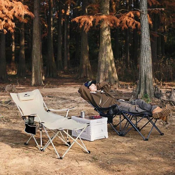Dual-purpose camping chair that converts into a tilting chair, includes headrest and storage bag with 20kg weight capacity