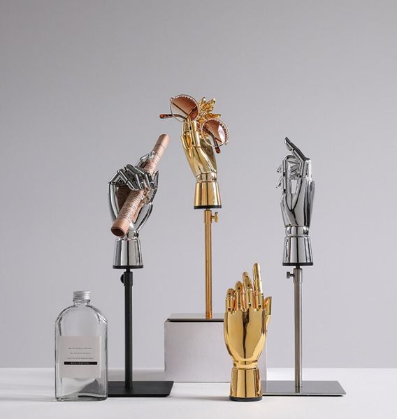 Electroplated hand model props for commercial furniture displays, featuring gold and silver jointed artificial hands ideal for clothing shops and studio decor