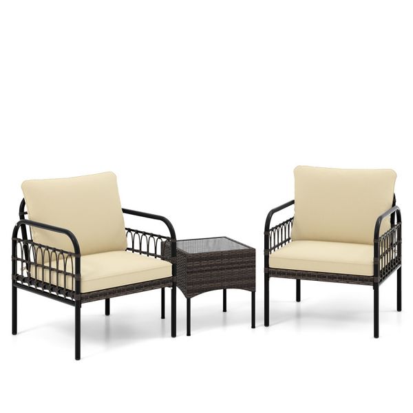 Elegant outdoor wicker lounge set for gardens, featuring plush cushions and a durable glass-top side table