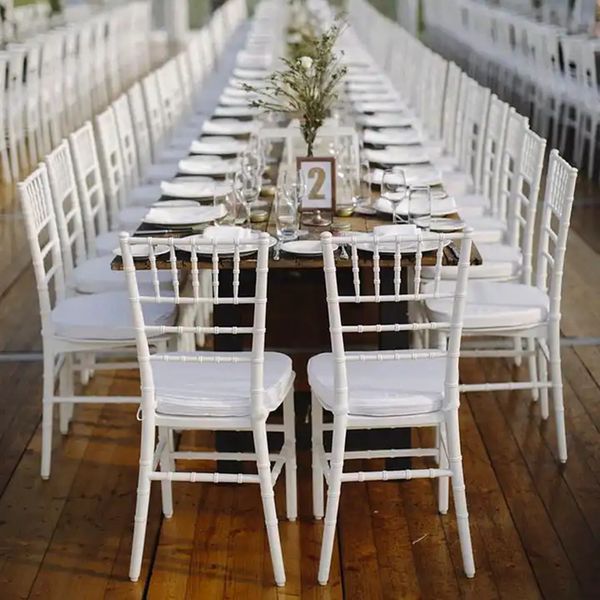 Elegant white PC stacking event furniture for luxury weddings, featuring Napoleon and Chiavari chairs