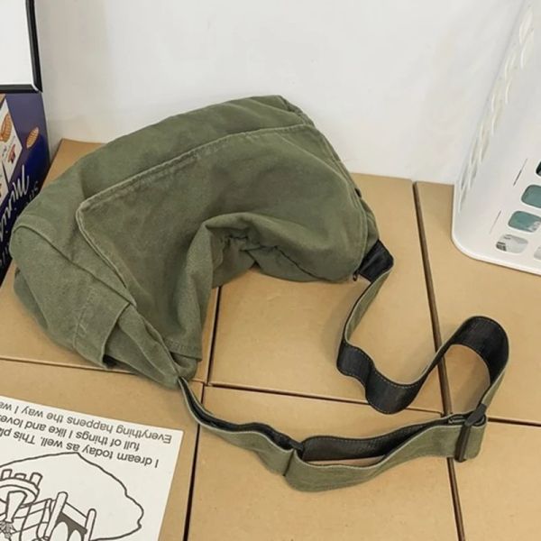 Female canvas hobo bag with soft slouchy design, perfect for Y2K students as a medium-sized leisure or school bag for books and laptops