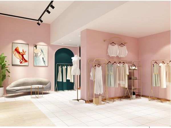 Floor-standing luxury gold women's clothing rack for boutique display