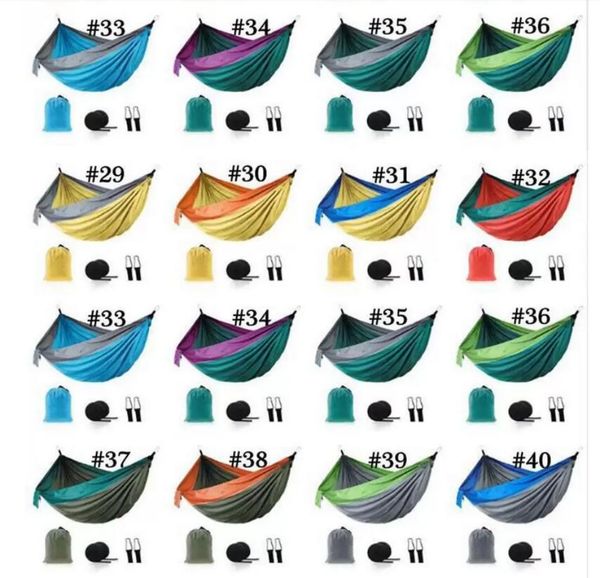Foldable outdoor parachute cloth hammock with ropes and carabiners, available in 12 colors for camping and beach use