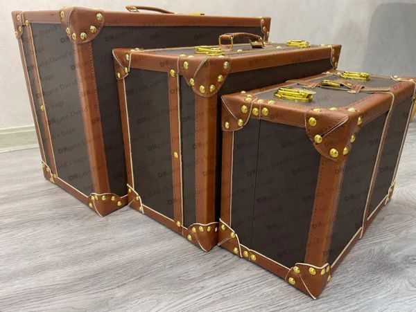 France's premium luxury men's and women's suitcases, travel bags, and handmade striped trunk storage boxes