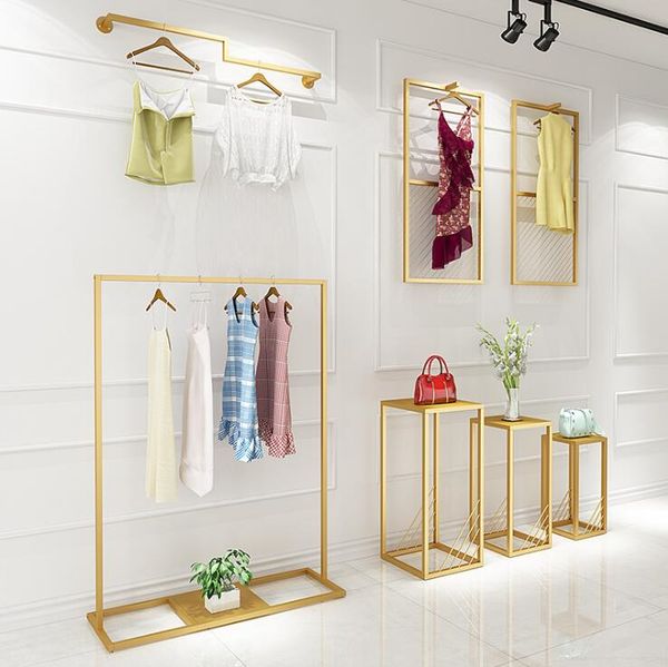 Golden iron clothing rack for modern bedrooms, a simple floor hanger or wall shelf for vintage-style clothes storage