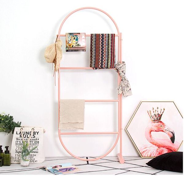 Golden wall-mounted clothing rack for kids, minimalist floor hat stand, stylish scarf display