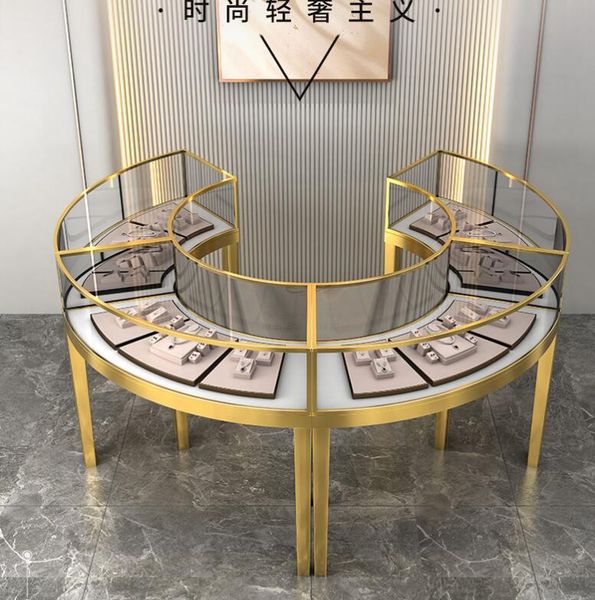 Gold-plated curved jewelry showcase with glass top and stainless steel base for retail displays