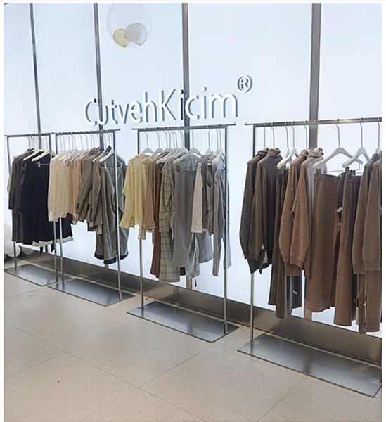 Landing commercial furniture for clothing stores featuring simple display racks, customizable shelves for clothes and hats