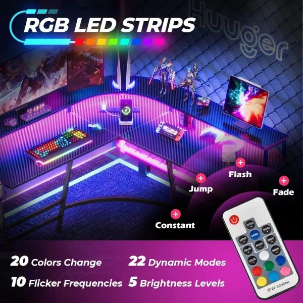 L-shaped gaming desk featuring LED lights, power outlets, and monitor shelves