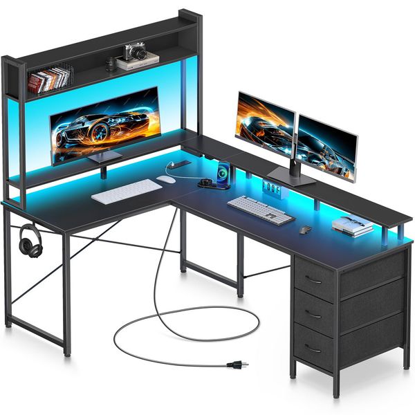 L-shaped gaming desk with reversible LED lights, power outlets, storage drawers, and a monitor stand for home office use