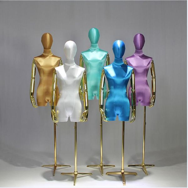 Luxurious golden-arm wedding dress display stand for high-end silk satin gowns in boutique showcases