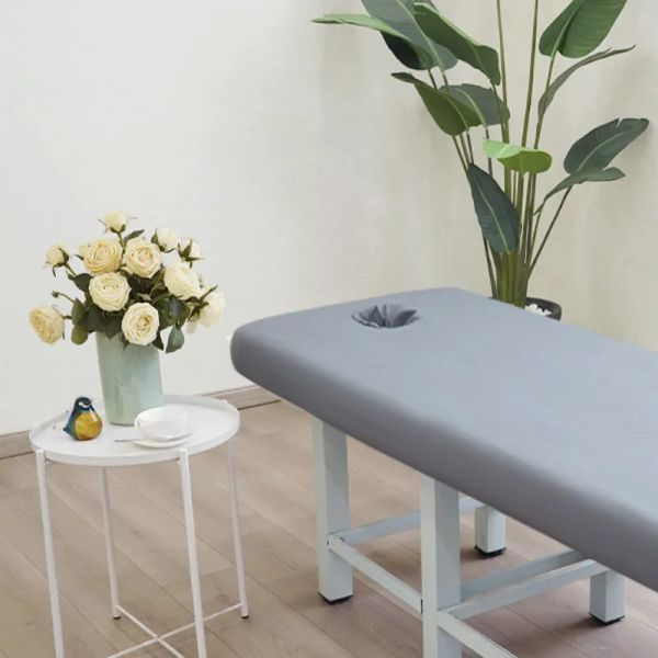 Massage table fitted sheet with elastic edge and face hole for spa treatments