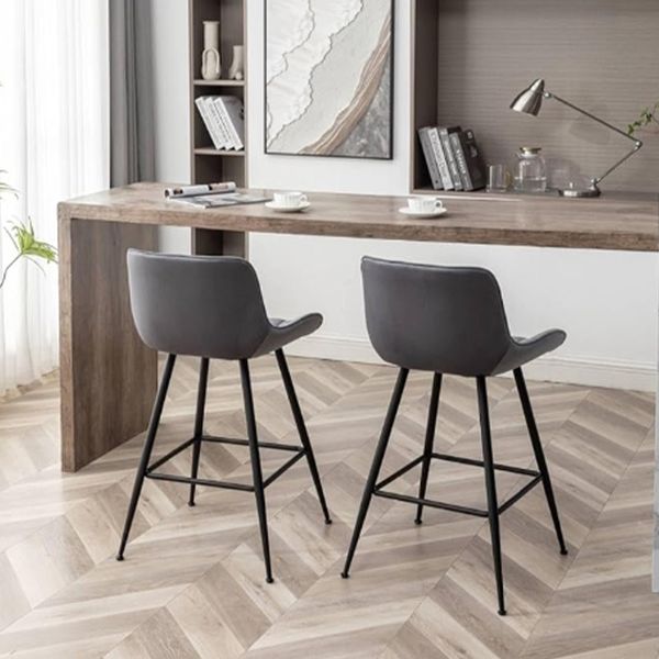 Modern adjustable-height bar stool featuring a sturdy metal frame and cozy seat