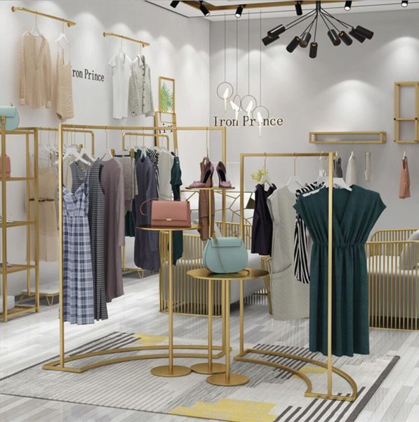 Modern minimalist gold women's clothing floor display racks for commercial use in shopping malls