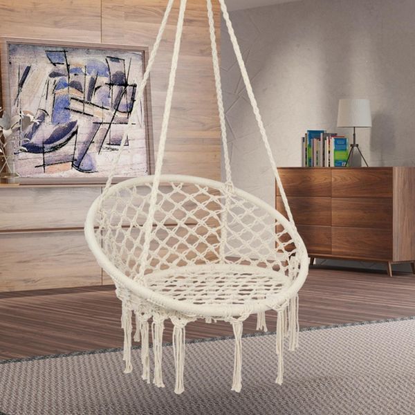 Outdoor hammock swing chair for relaxation in bedroom or garden, featuring tassel details and knitted mesh rope design