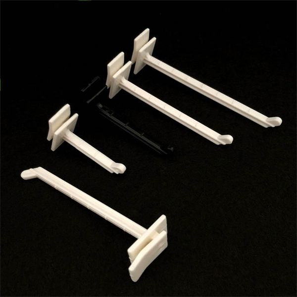 Plastic and cardboard display hangers for slatwall hooks in supermarkets
