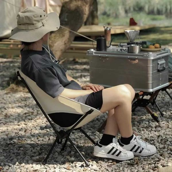 Portable outdoor folding chair with breathable mesh backrest, ideal for camping, fishing, beach picnics, and art painting