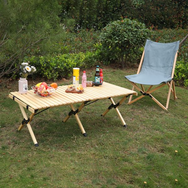 Portable solid wood folding table for versatile indoor and outdoor use, ideal for picnics, camping, and travel