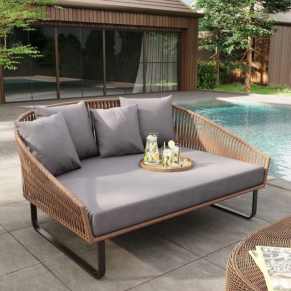 Rattan Outdoor Patio Daybed featuring a Black Aluminum Frame and Gray Cushion Pillow, model ODF013