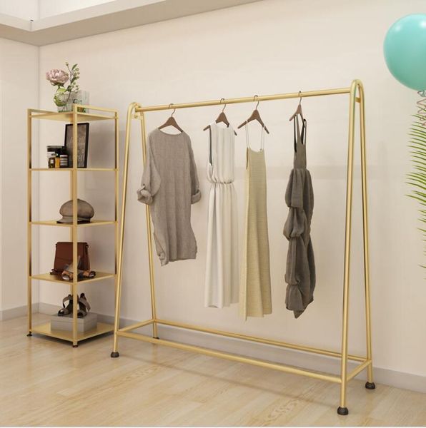 Simple metal clothing rack for commercial use in bedrooms, cloakrooms, or shops with gold fabric display stands