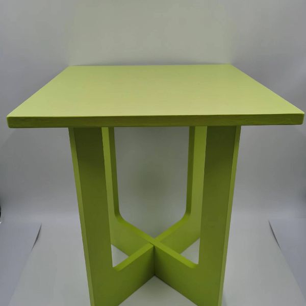 Versatile small green stool that doubles as a coffee table for home decor