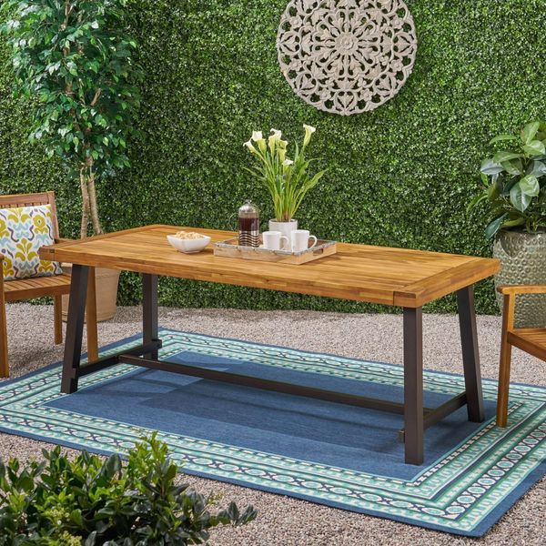 Wooden outdoor dining table for garden, patio, picnic, and camping use